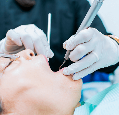 Dentist performing a procedure on a patient.